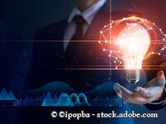 Businessman holding light bulb and brain network with icon business and technology, innovative in futuristic, network connection on interface background, abstract, innovation and technologies.